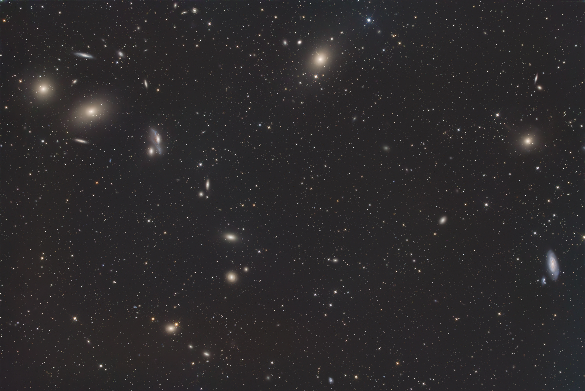 The arc-shaped galaxies of the Markarjan Chain with the galaxies Messier 84 and Messier 86 at the top left, the galaxy Messier 87 at the top-middle and the two galaxies Messier 89 and Messier 90 on the right are located in the constellation Virgo.